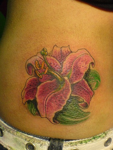 Lush pink lily tattoo