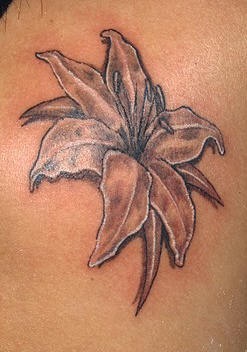 Black lily flower tattoo