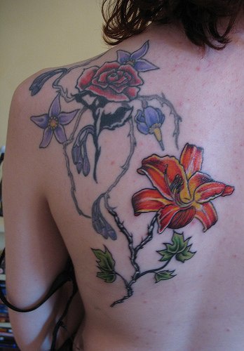 Rose and lily flowers tattoo in colour
