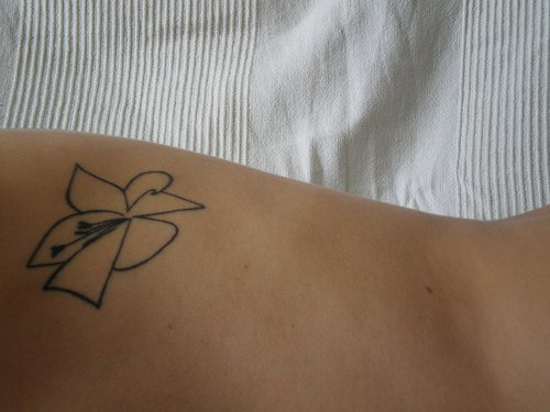 Black line lily tattoo
