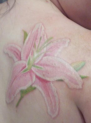 Tender pink lily tattoo