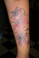 Purple and pink lilies tattoo