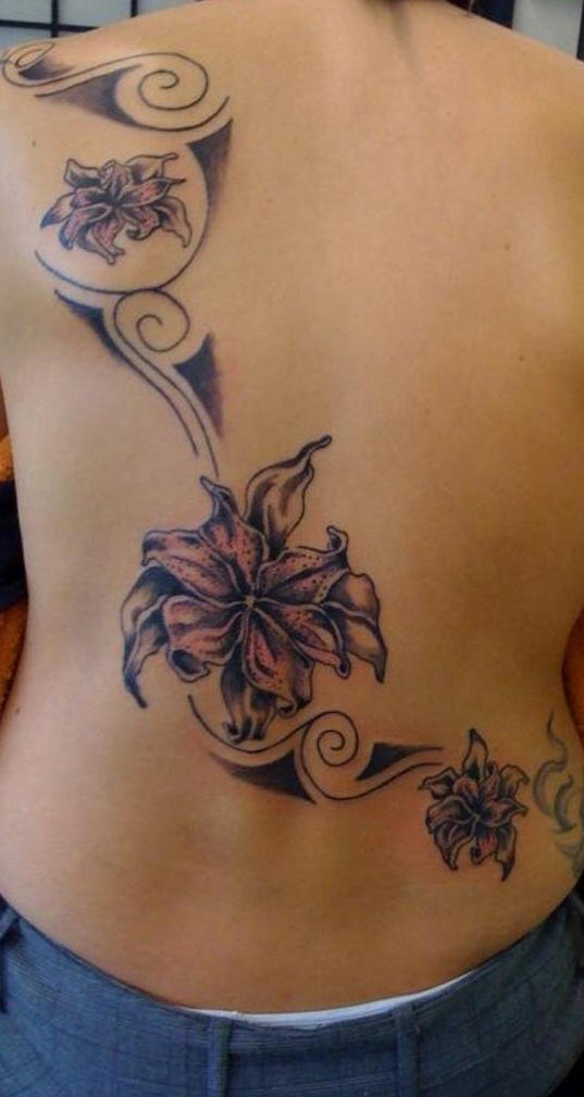 Lily flower in tribal tracery tattoo