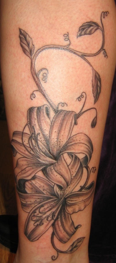 Lily flowers black ink tattoo