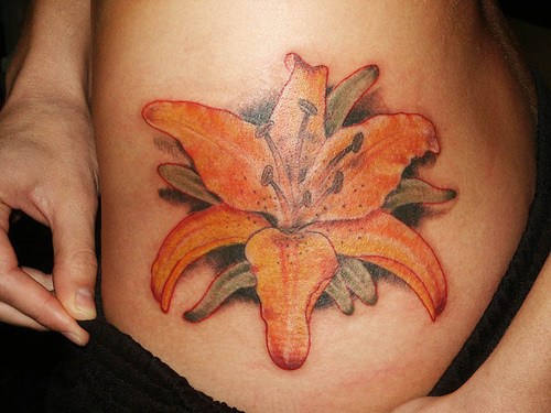 Lily flower tattoo on hip