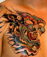 Asiatischer mythischer Löwe Tattoo in Farbe