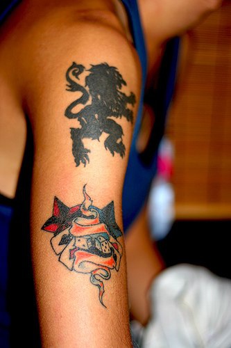 Black heraldic lion tattoo