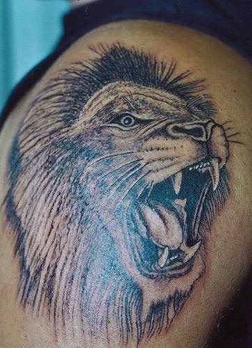 Realistic roaring lion tattoo