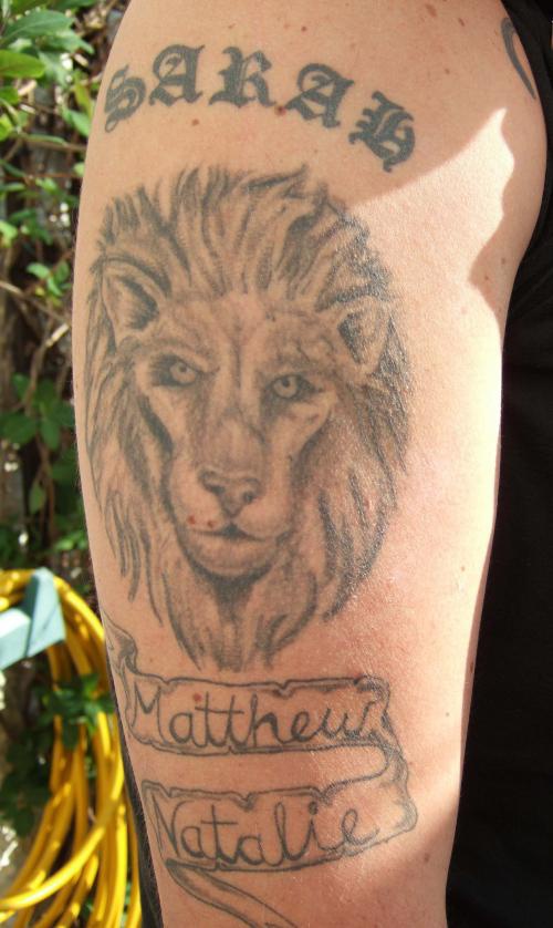Lion head memorial tattoo