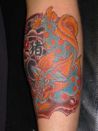 Oriental style colourful lion tattoo