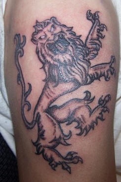 Roaring heraldic lion tattoo