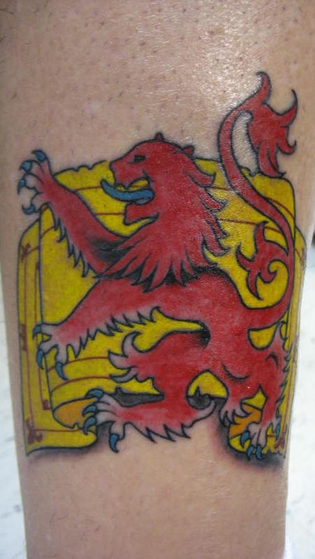 Red heraldic lion on yellow flag tattoo