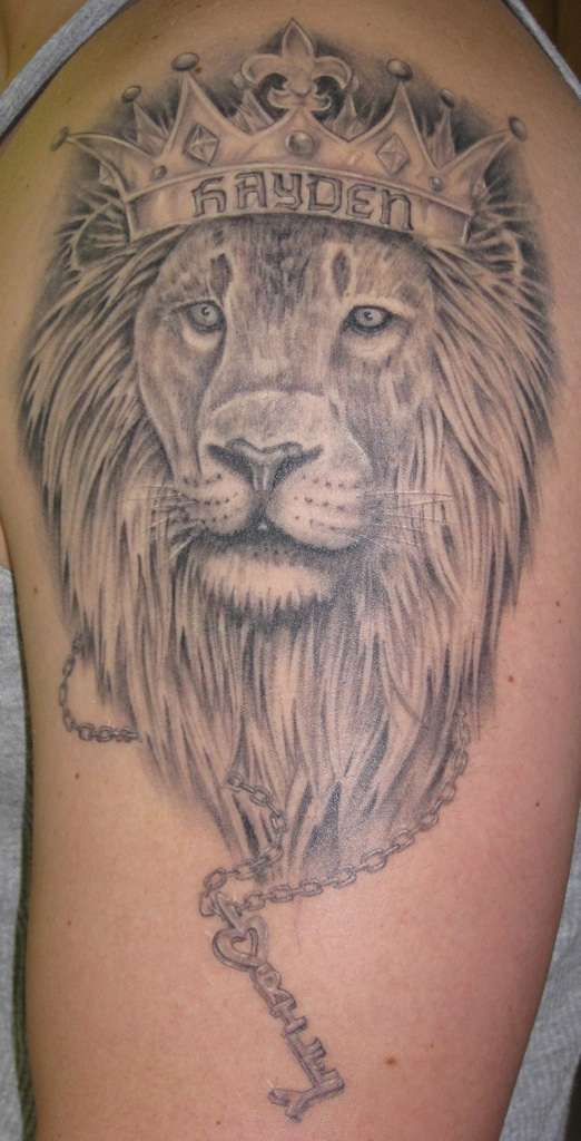 Crowned lion with key tattoo