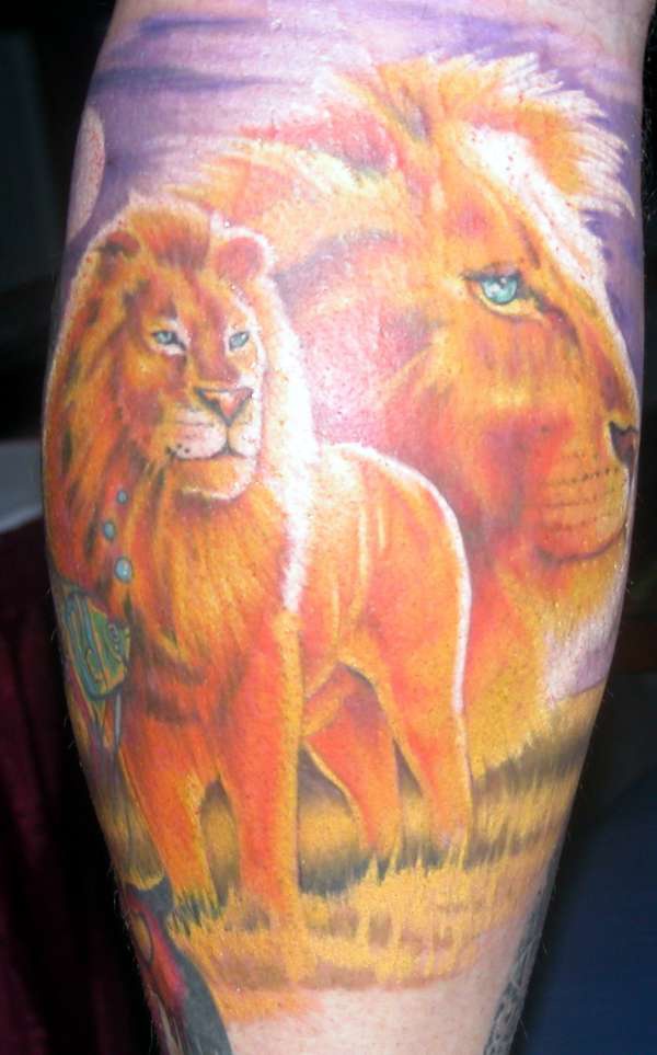 Colourful lion and son tattoo