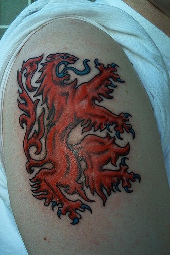 Red heraldic lion tattoo