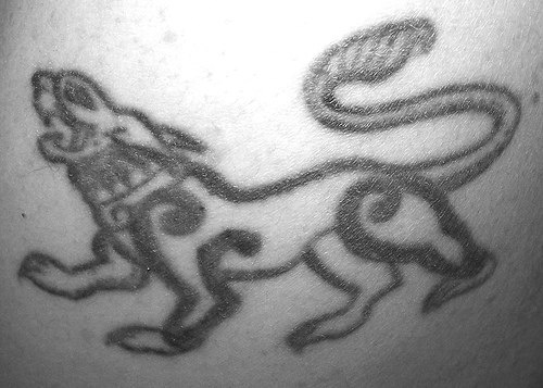 Tracery lion black ink tattoo