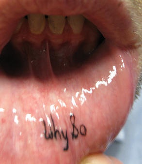 Lip tattoo, why and o, black thin inscription