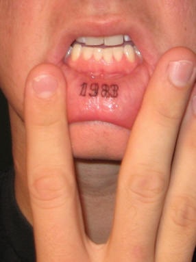 Lip tattoo, 1983, black date, named year