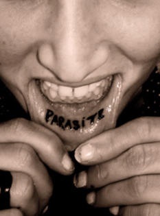 Lip tattoo, parasite, black, bold  inscription