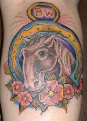 Horse portrait in horseshoe tattoo in colour