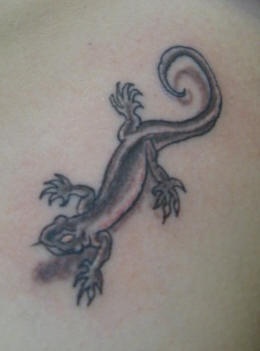 Crawling black lizard tattoo
