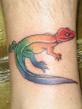Rainbow coloured lizard tattoo
