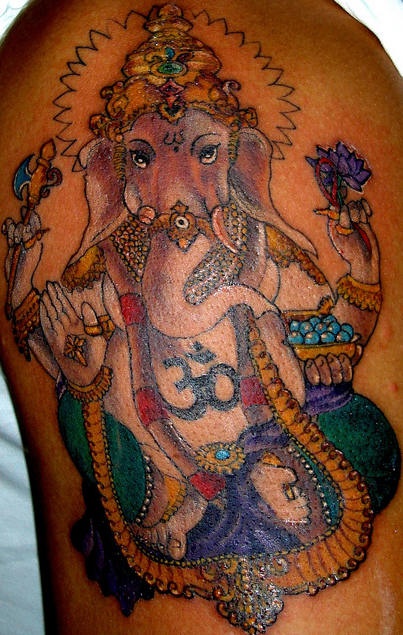 Lord ganesha in gold tattoo