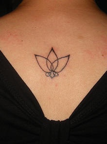Super minimalistic lotus tattoo