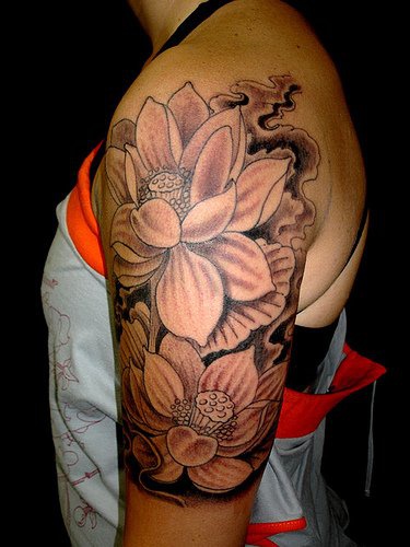 Highly detailed lotus flower on shoulder