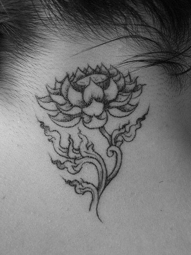 Small black lotus tattoo