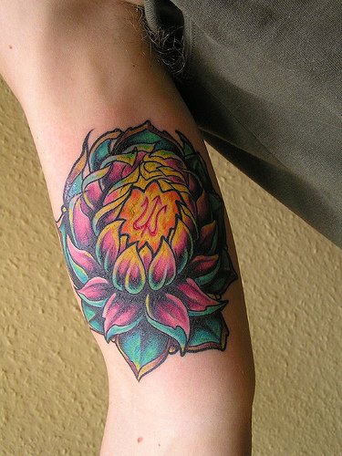 Detailed lotus flower tattoo on arm