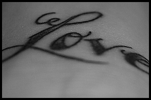 Love calligraphy writing tattoo