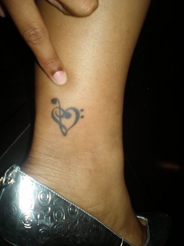 Treble clef heart tattoo on leg