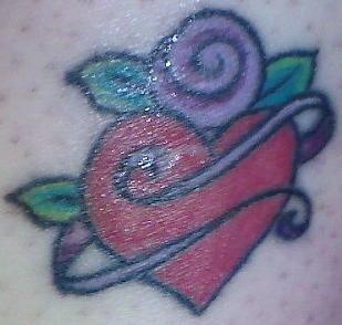 Red heart with purple rose tattoo