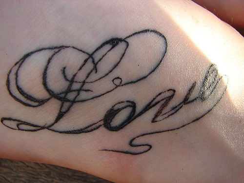 Love word lettering tattoo