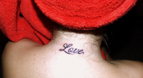 Love text tattoo on neck