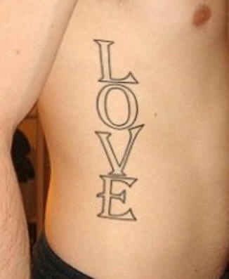Large love text tattoo on side