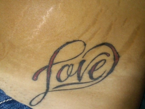 Love word in heart shape tattoo