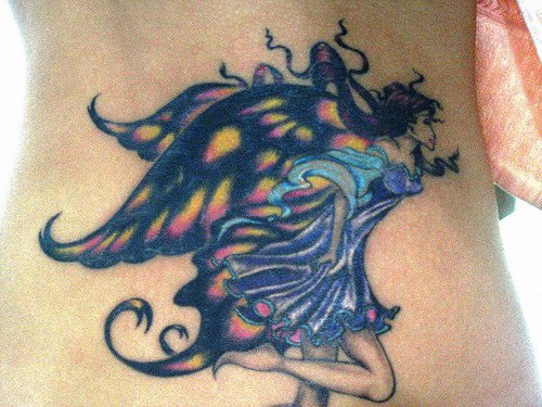 Lower back tattoo, beautiful, smart, charming fairy, big wings