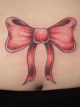 Lower back tattoo, big, red, beautiful bow