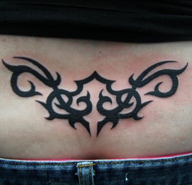 Lower back tattoo, black, bright, rounded pattern