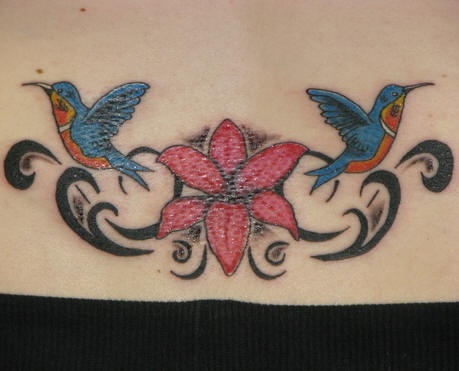 Lower back flower and hummingbirds tattoo