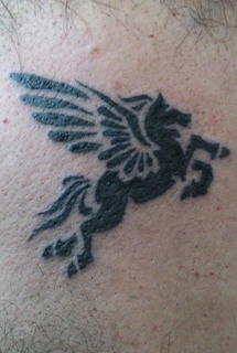 Flying black pegasus tattoo