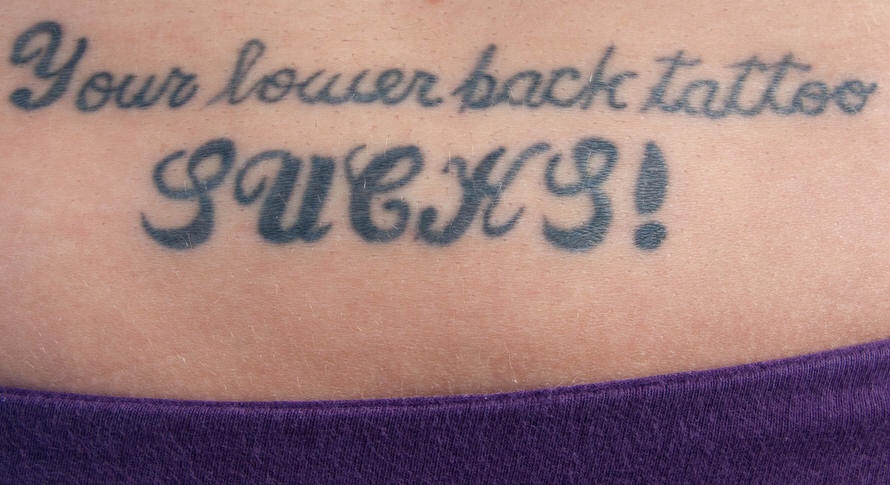 Lower back script tattoo, your tattoo sucks