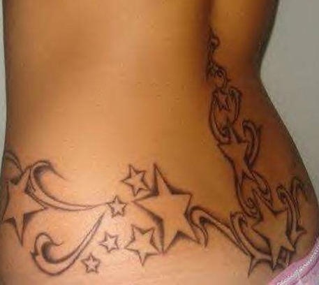 Lower back tattoo, many designed  stars