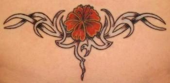 Lower back tattoo, nice red flower in black styled pattern