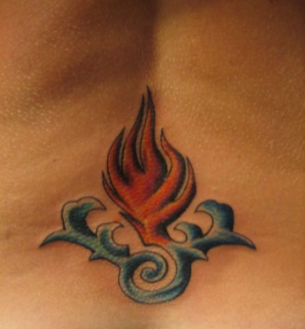 Lower back tattoo, styled little fire in water