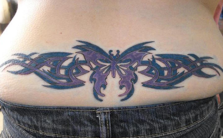Lower back butterfly tattoo, black and violet styled, dark,