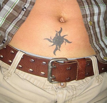 Lower stomach tattoo, fat, black  beetle