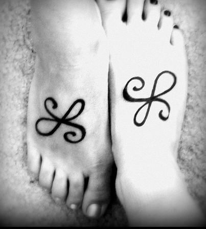 Matching friendship symbol tattoos